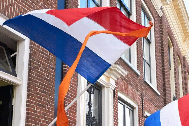 Dutch,Flags,With,Orange,Streamer,Waving,In,The,Wind,On